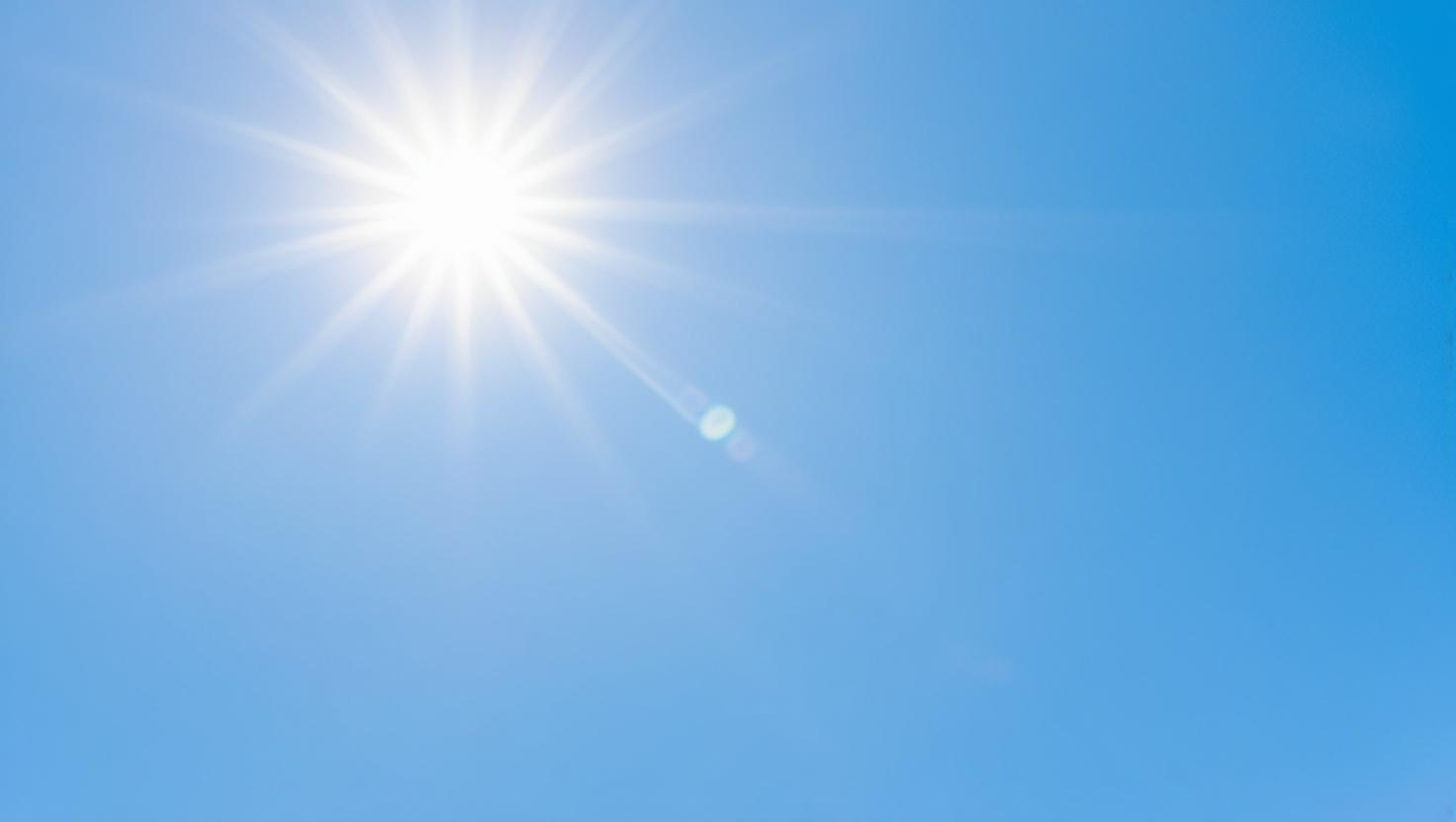 Create_a_zoomed-in_high-detail_image_of_a_bright_blue_sky_that_visually._The_sky_should_appear_vibrant_and_illuminated_with_a_strong_yet_soft_glow_evoking_the_feeling_of_sun_protectio.jpg
