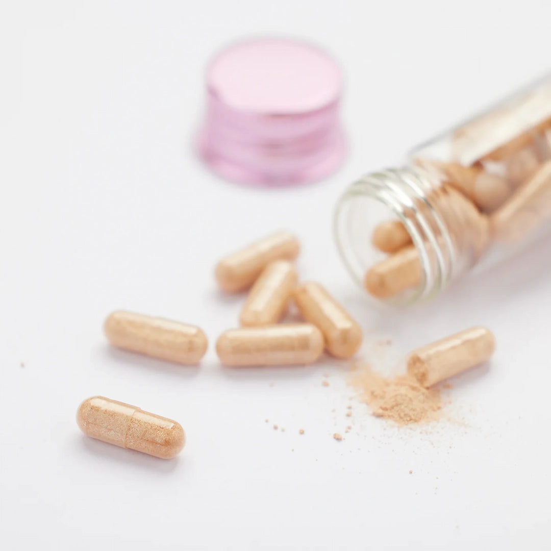 Pycnogenol supplement tablets displayed outside bottle for skin health