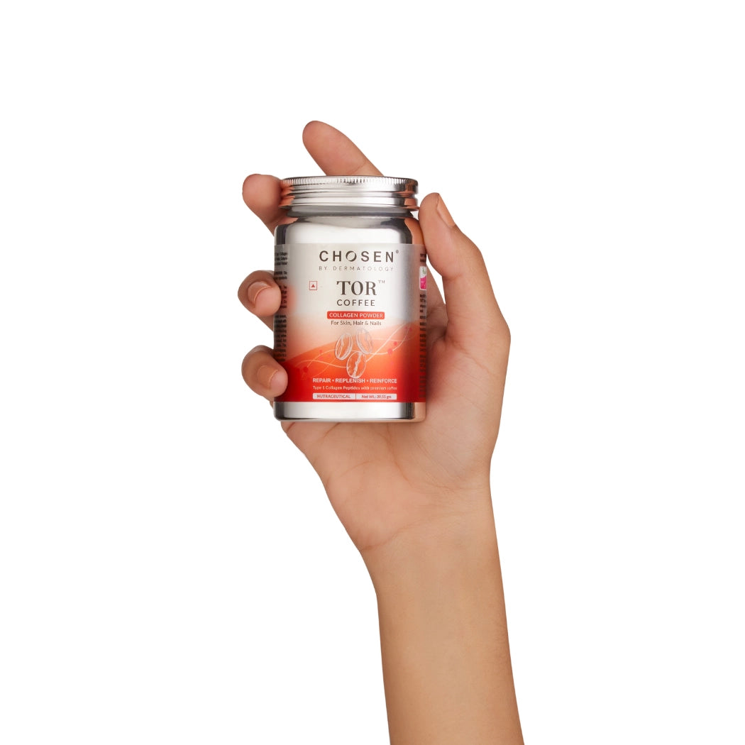 Female hand holding tor coffee collagen tin