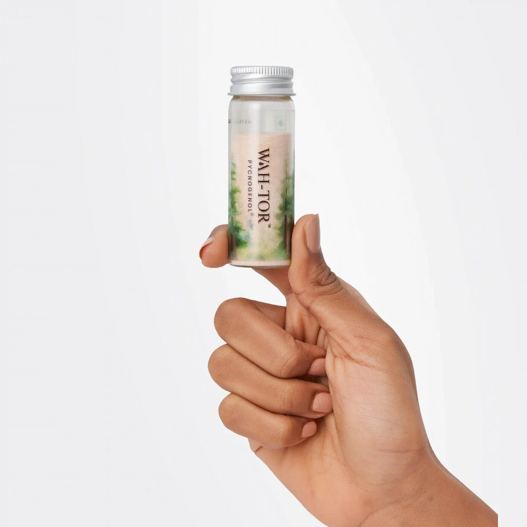 Hand holding a bottle of vegan collagen Pycnogenol supplement